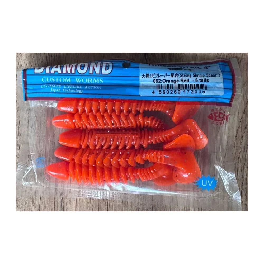 Мягкие приманки DIAMOND CUSTOM WORMS THREAD T-TAIL 4" 052: Orange Red - 5 tails — улучшенное фото